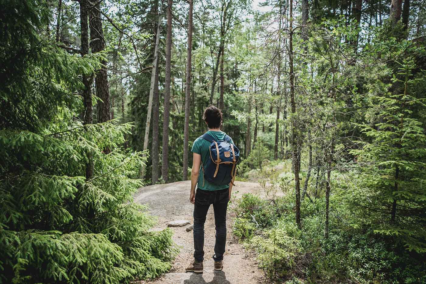 Person standing in a hike trail