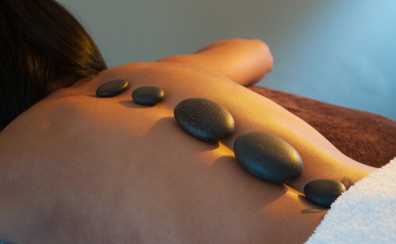 Person having hot stone massage